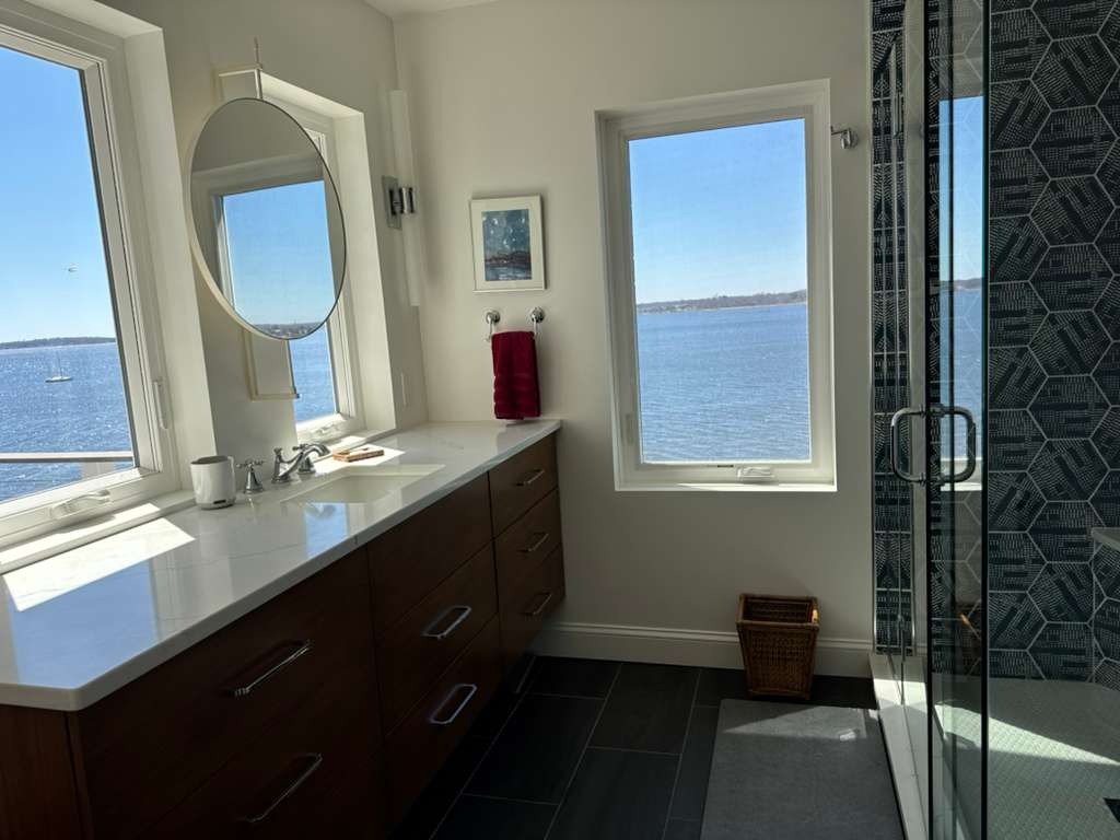 Primary bathroom — water views from every window
